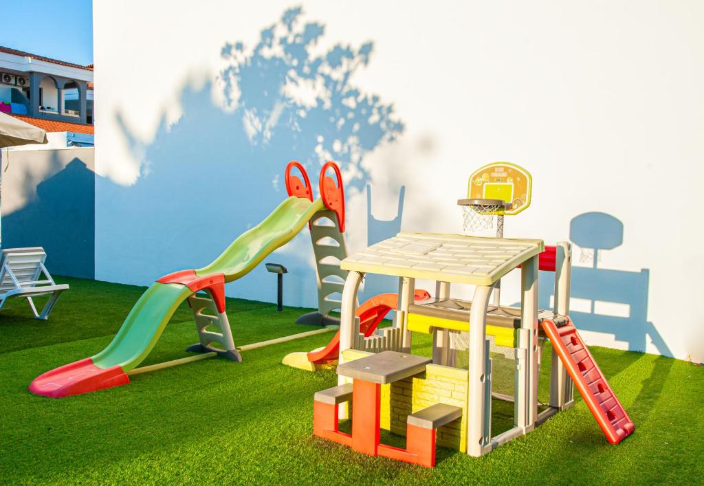 a playground with different types of play equipment at Acrotel Lily Ann Village in Nikiti