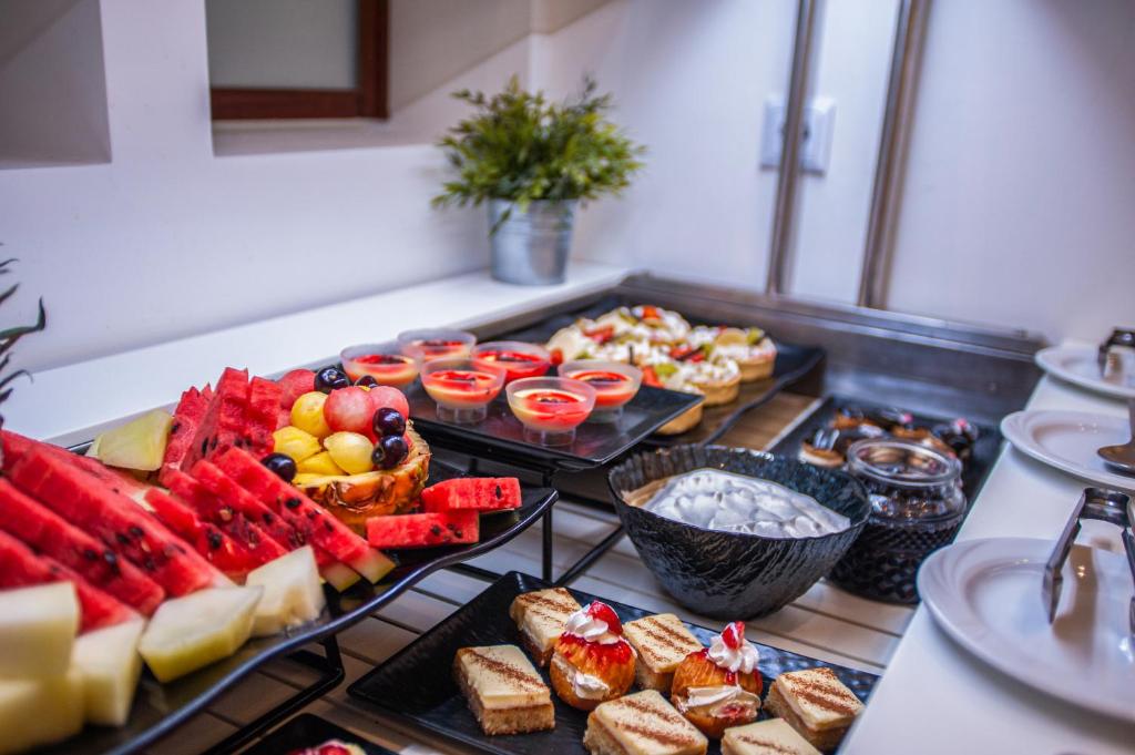 a buffet with different types of food on a table at Acrotel Lily Ann Village in Nikiti