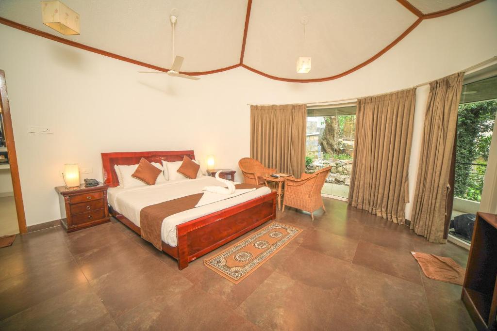 Postel nebo postele na pokoji v ubytování WOW Bison Woods Organic Veg Resort - Yercaud