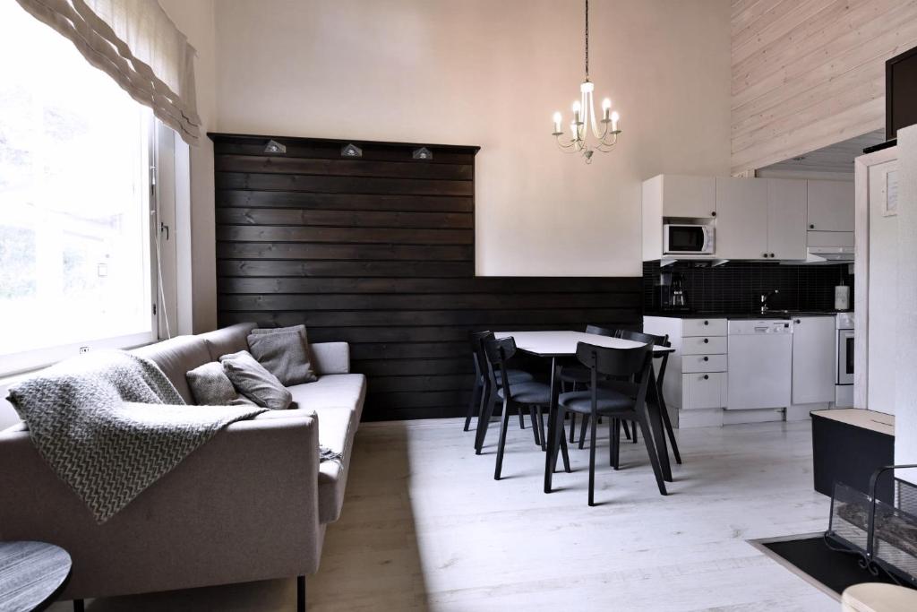 a living room with a couch and a table at Economy Tieva in Levi