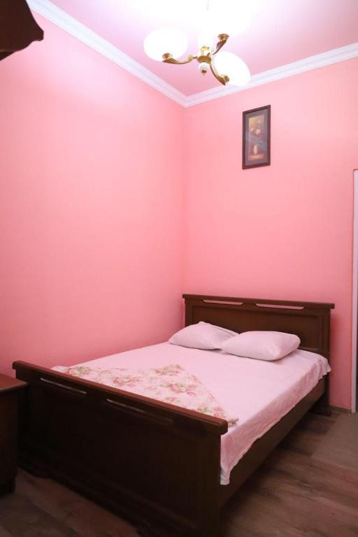 Postel nebo postele na pokoji v ubytování Tnak Hotel