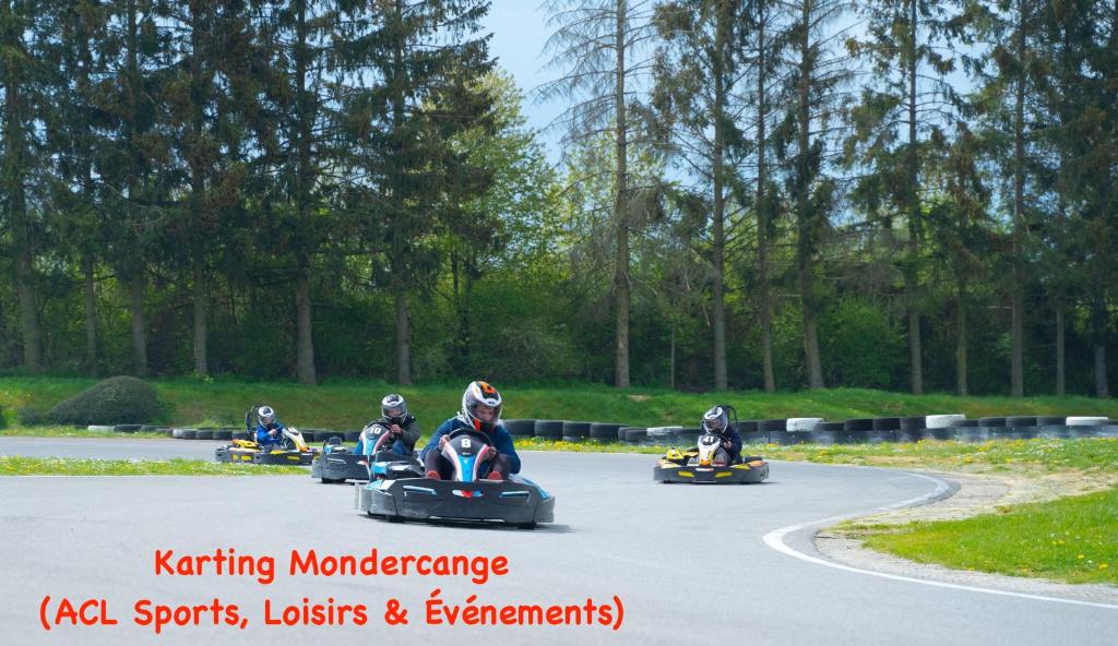 a group of people riding down a road onagogswersswersswers at Hotel Monvillage in Mondercange