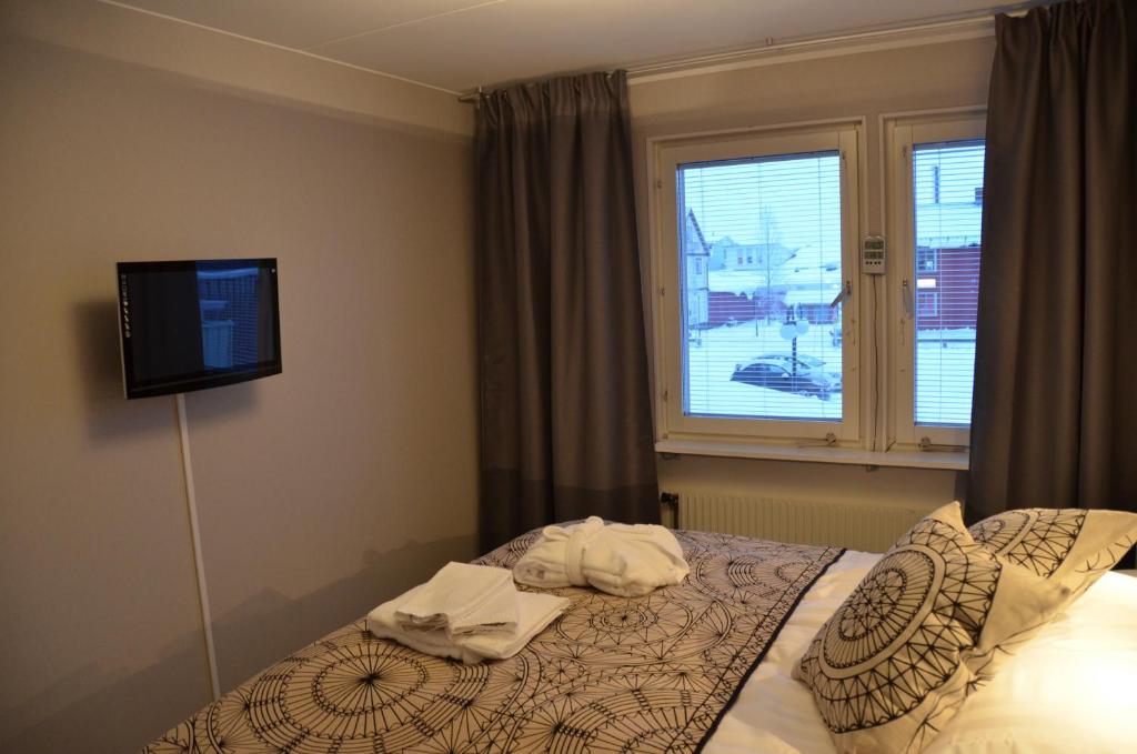 Postel nebo postele na pokoji v ubytování Simloc Hotel Drottninggatan