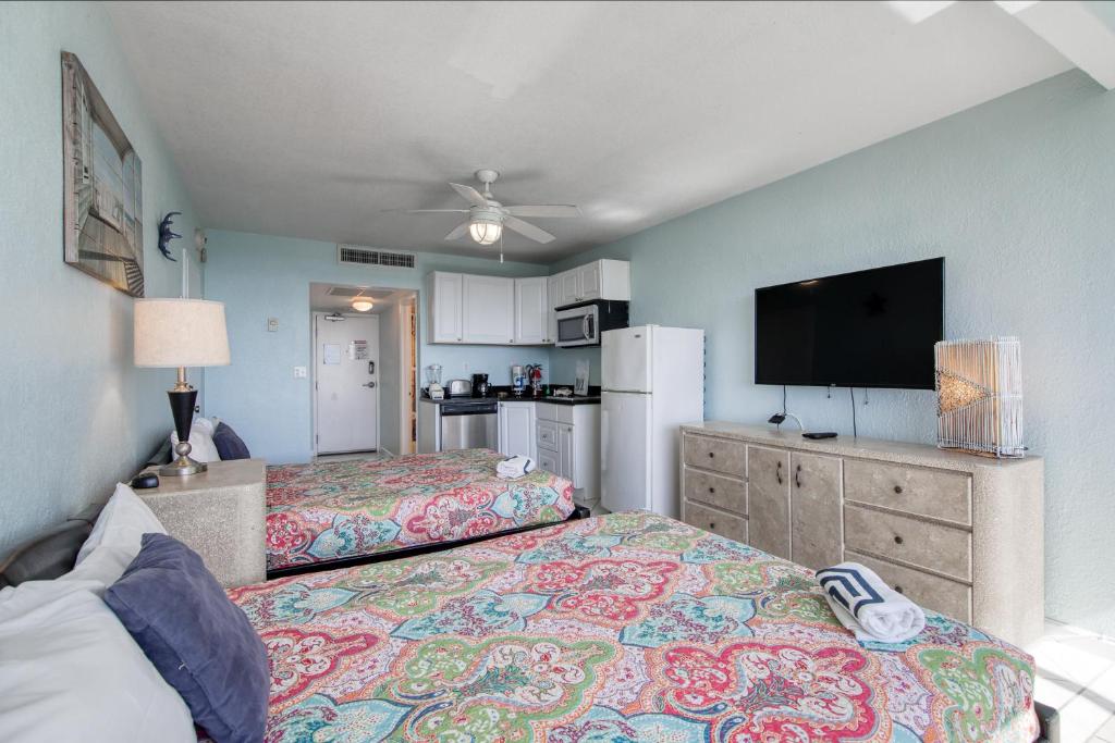 a bedroom with two beds and a flat screen tv at Perfect Panorama - #905B in Fort Lauderdale