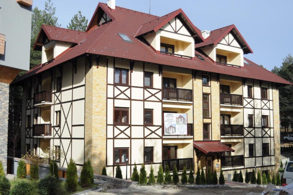 an old building with a red roof at Apartment Kiki in Zlatibor
