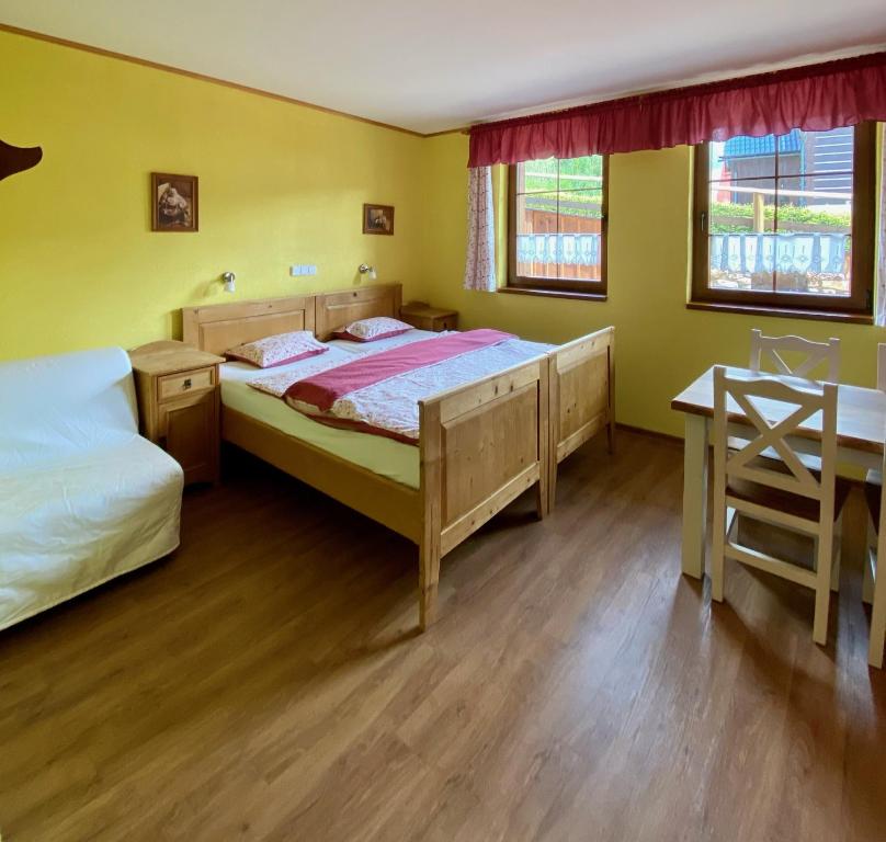 Postel nebo postele na pokoji v ubytování Penzion Major