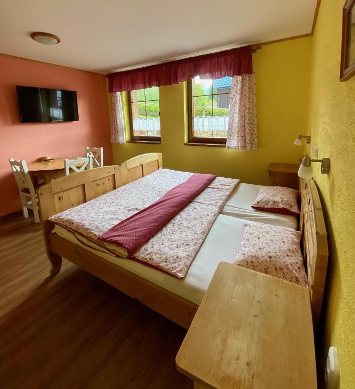 Postel nebo postele na pokoji v ubytování Penzion Major