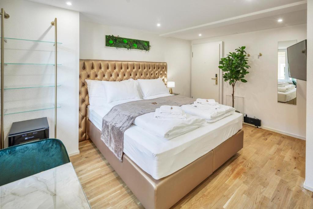 Postel nebo postele na pokoji v ubytování EH Apartments Saturn