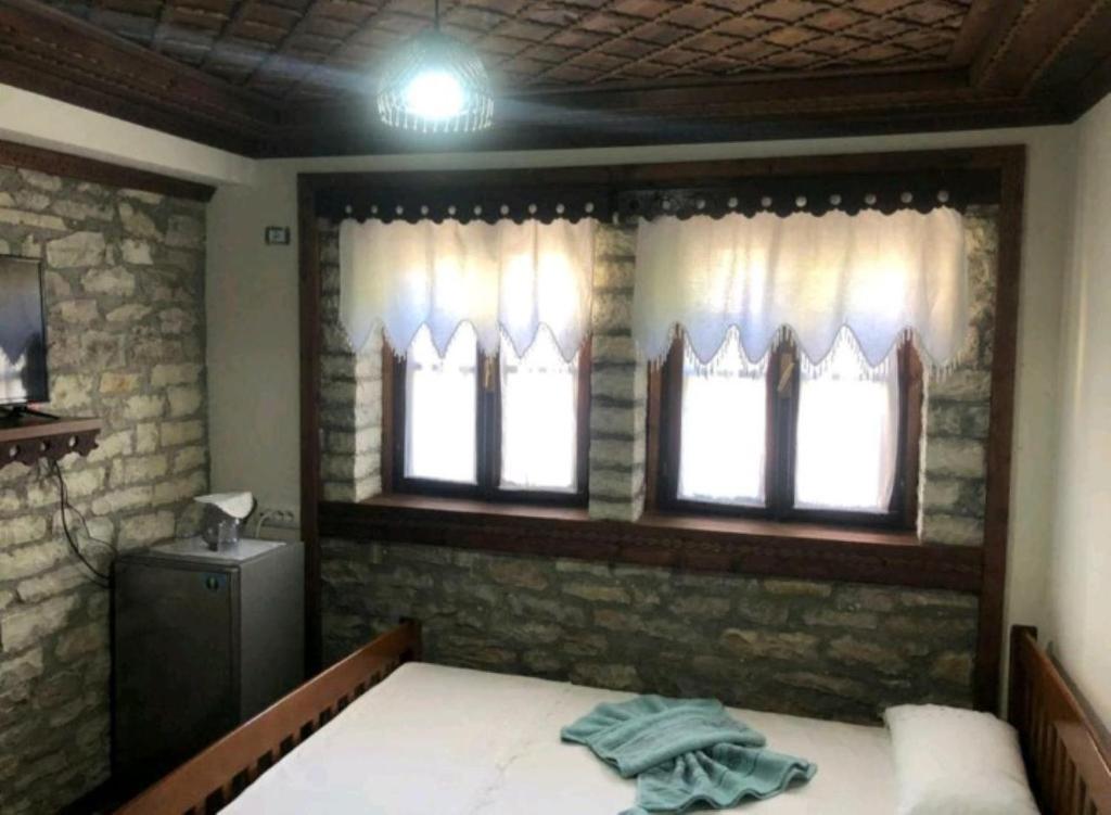 Letto o letti in una camera di MiziriGuestHouse