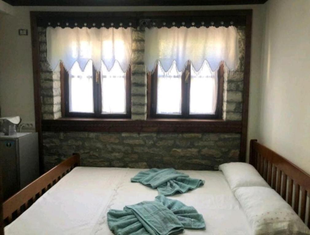 Letto o letti in una camera di MiziriGuestHouse