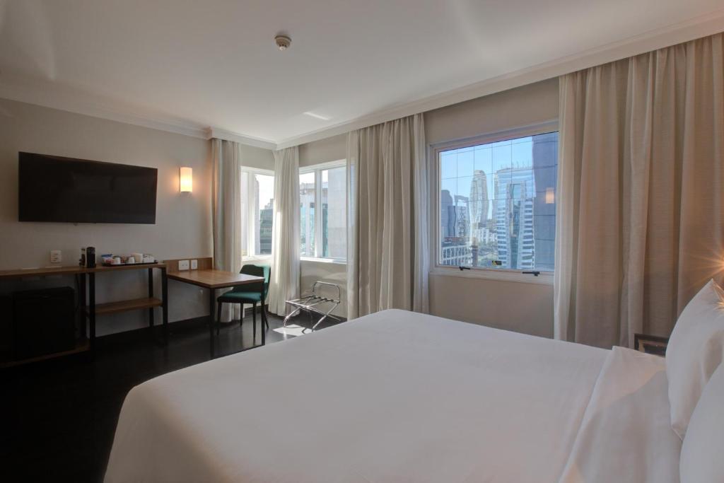 Ένα ή περισσότερα κρεβάτια σε δωμάτιο στο Park Inn by Radisson Berrini