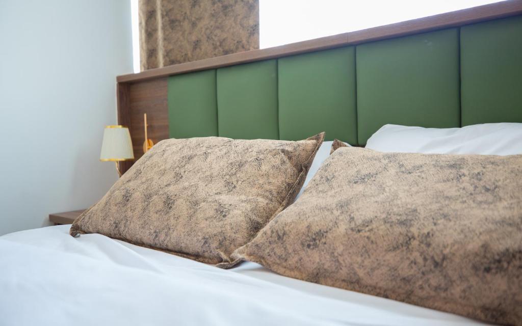 Postel nebo postele na pokoji v ubytování Hotel Cataleya