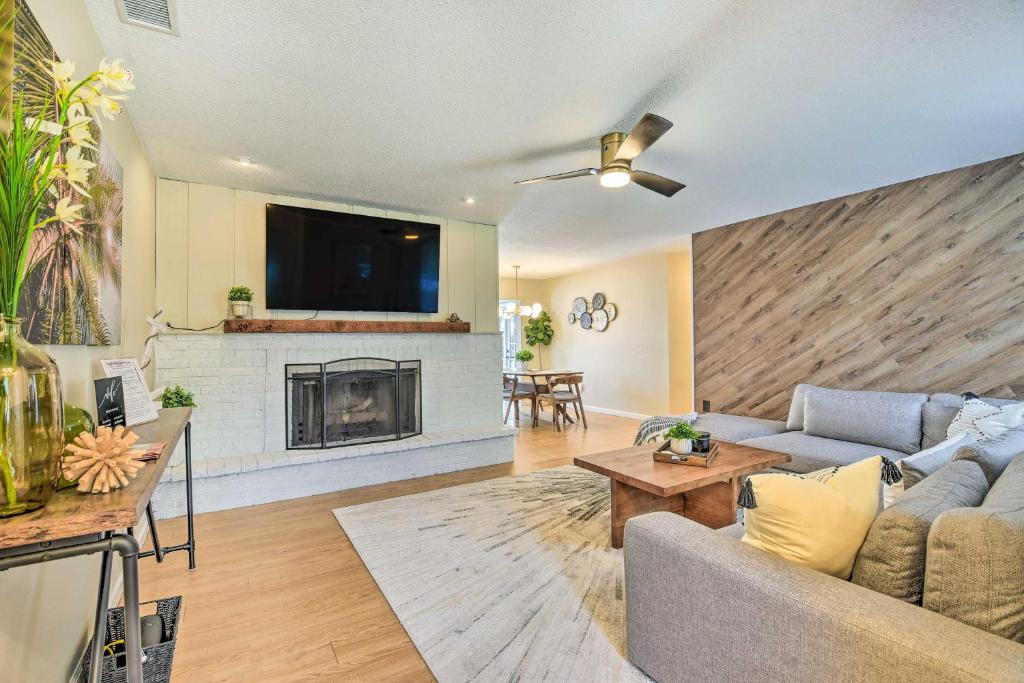 a living room with a couch and a fireplace at 8 Mi to Beaches Bradenton Home with Poolside Oasis! in Bradenton