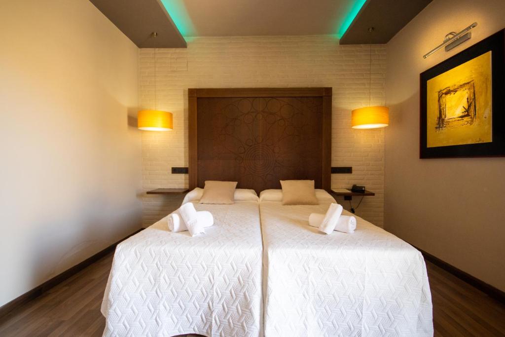 Postel nebo postele na pokoji v ubytování Hotel Villa De Setenil
