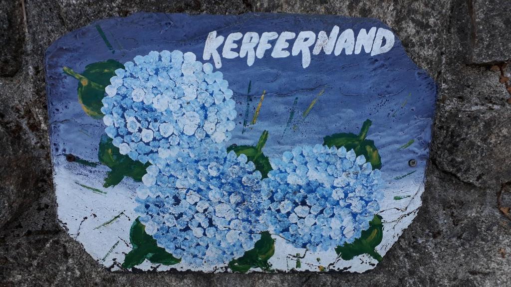 a cake with blue flowers on top of it at KERFERNAND 