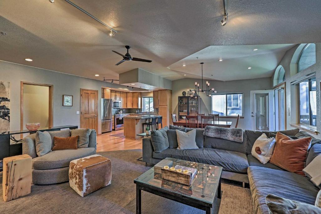 a living room with a couch and a table at Modern Frisco Condo with Deck Walk to Main St! in Frisco