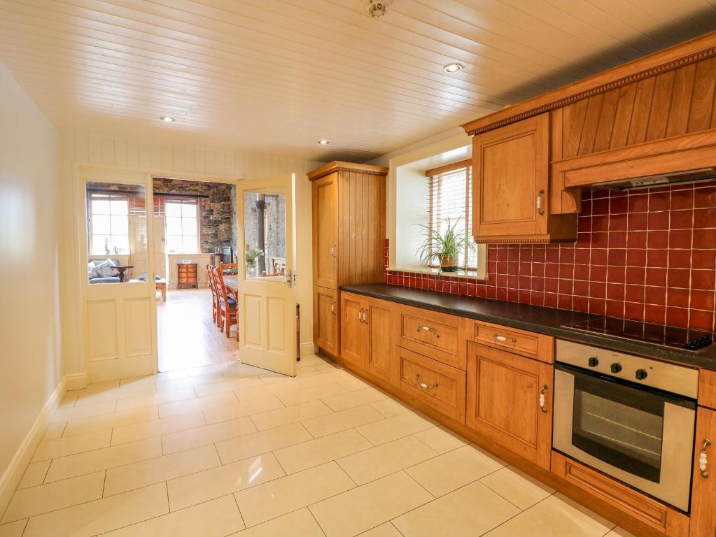Kuchyň nebo kuchyňský kout v ubytování Coach House