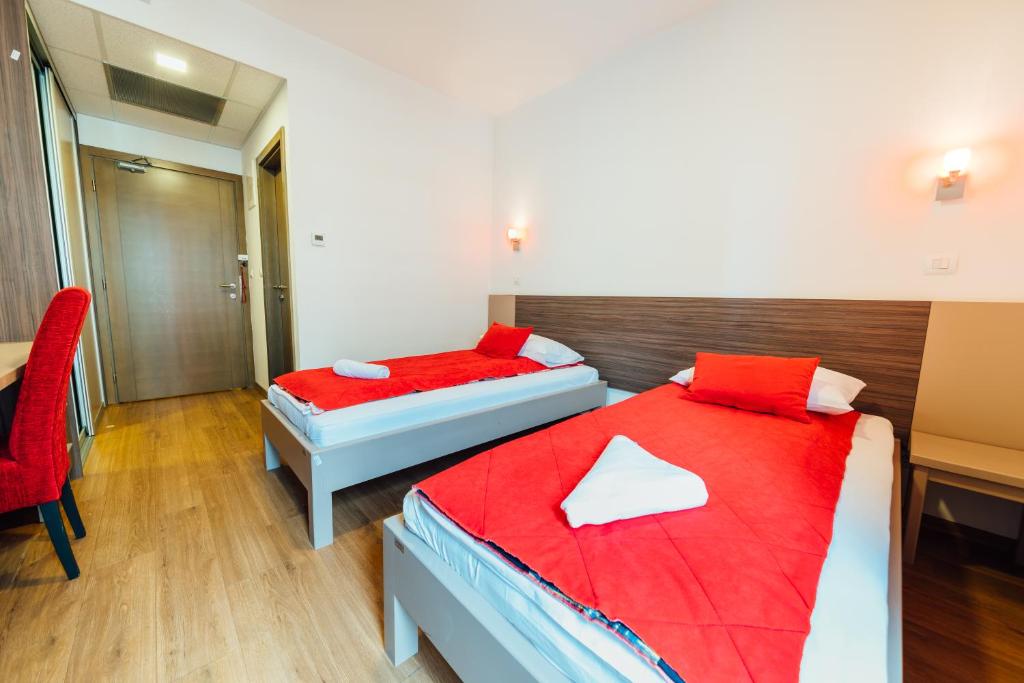 Postel nebo postele na pokoji v ubytování Hotel Walter