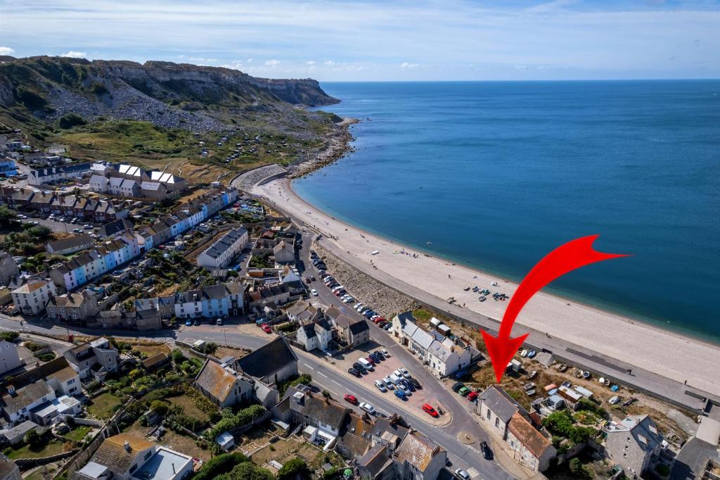 an aerial view of a beach with a red arrow at Cozy Cove Chapel in Portland
