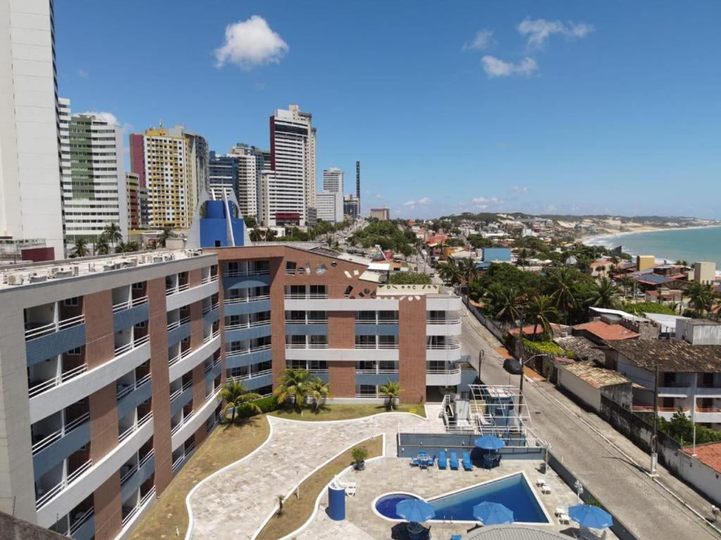an aerial view of a building with a swimming pool at Terrazzo PontaNegra flat Flat Vista Mar Apto 201 in Natal