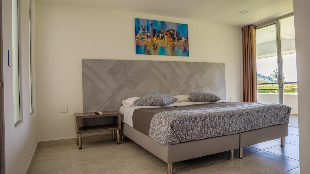Postel nebo postele na pokoji v ubytování HOTEl PALO GRANDE CF PEREIRA