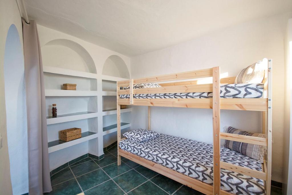 Postel nebo postele na pokoji v ubytování Casa Rosario, Frigiliana Large Historic Townhouse with Amazing Roof terrace HansOnHoliday Rentals
