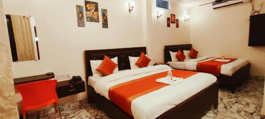 Postel nebo postele na pokoji v ubytování Hotel Shanti inn
