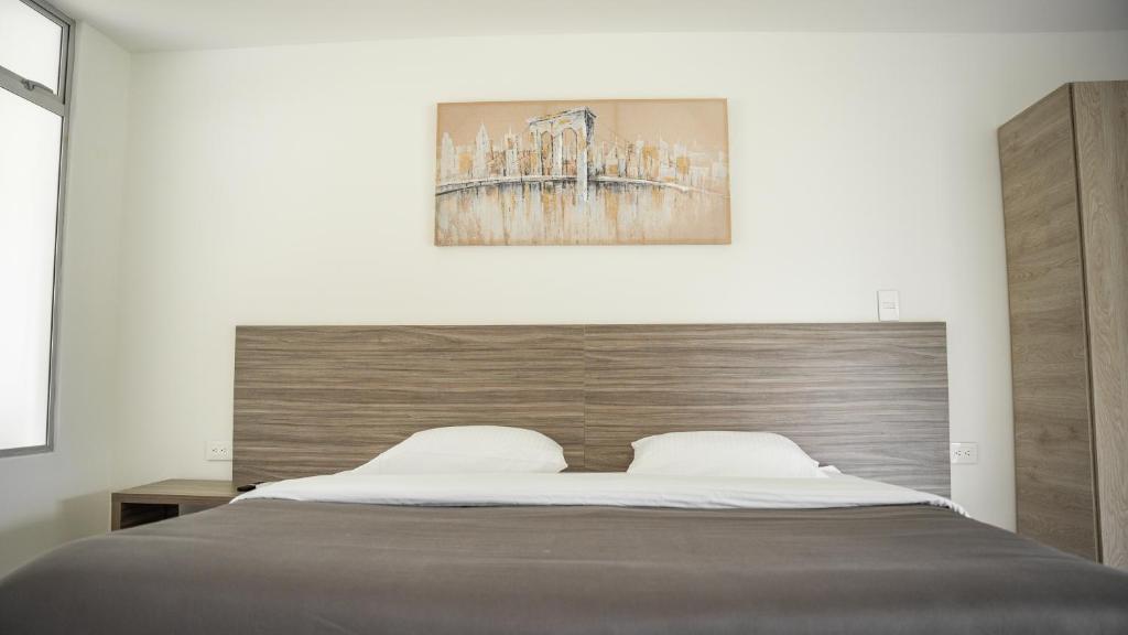 Postel nebo postele na pokoji v ubytování HOTEl PALO GRANDE CF PEREIRA