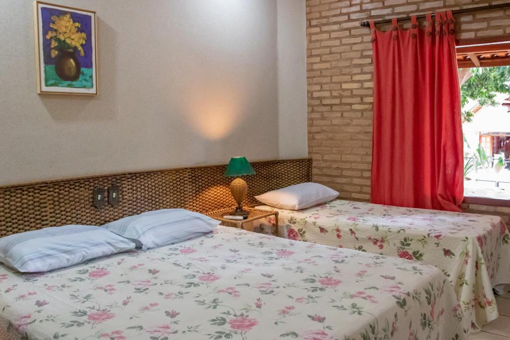 Postel nebo postele na pokoji v ubytování Pousada Beco da Lua