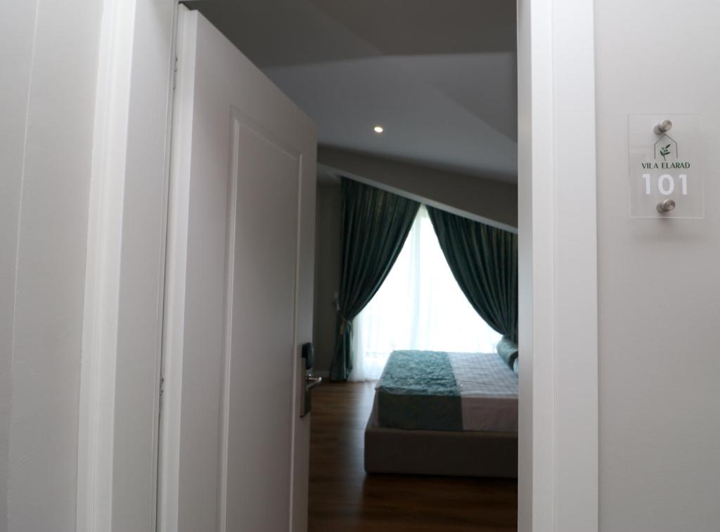 Postel nebo postele na pokoji v ubytování Vila ELARAD