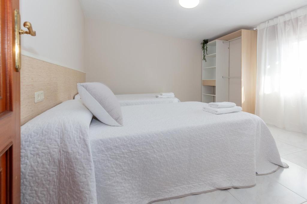 Postel nebo postele na pokoji v ubytování Casa Adriana