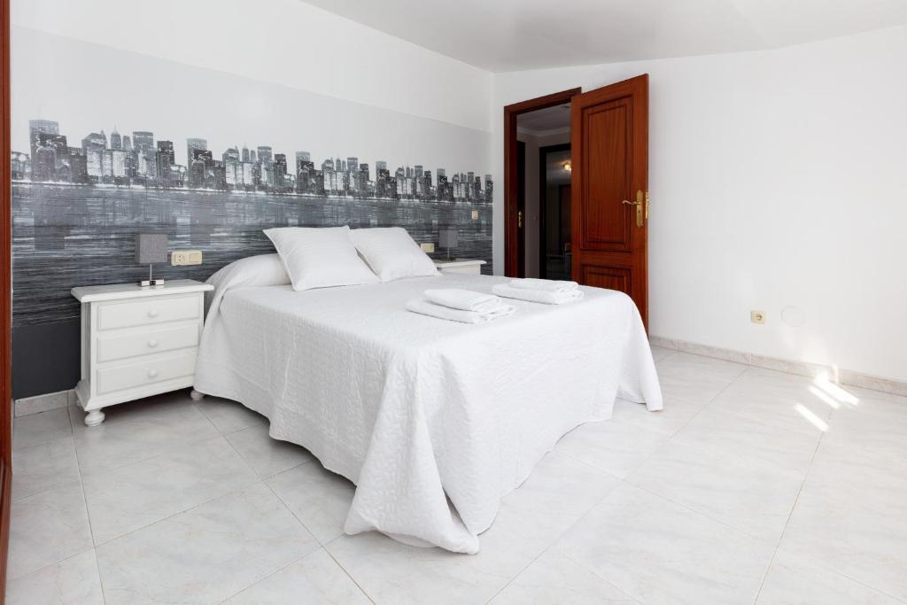 Postel nebo postele na pokoji v ubytování Casa Adriana