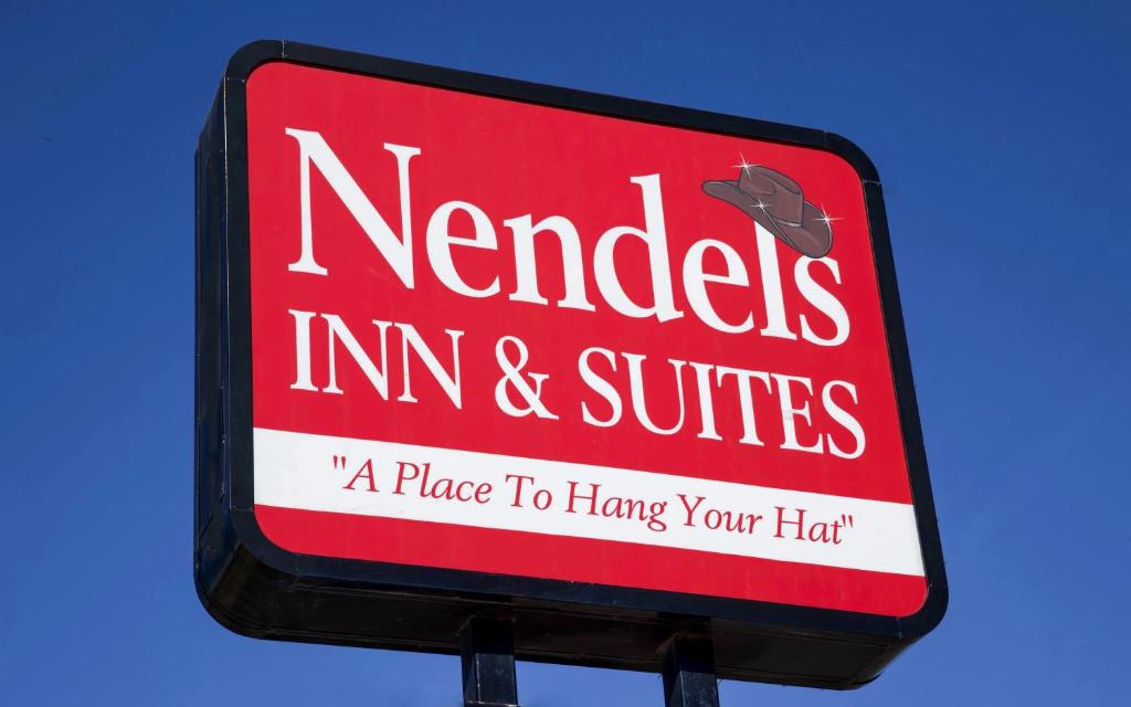 a sign for a nemedes inefficiencies istg at Nendels Inn & Suites Dodge City Airport in Dodge City