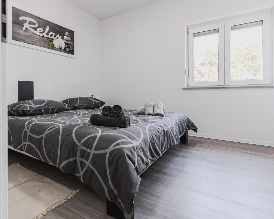 Postel nebo postele na pokoji v ubytování Apartments Marancin