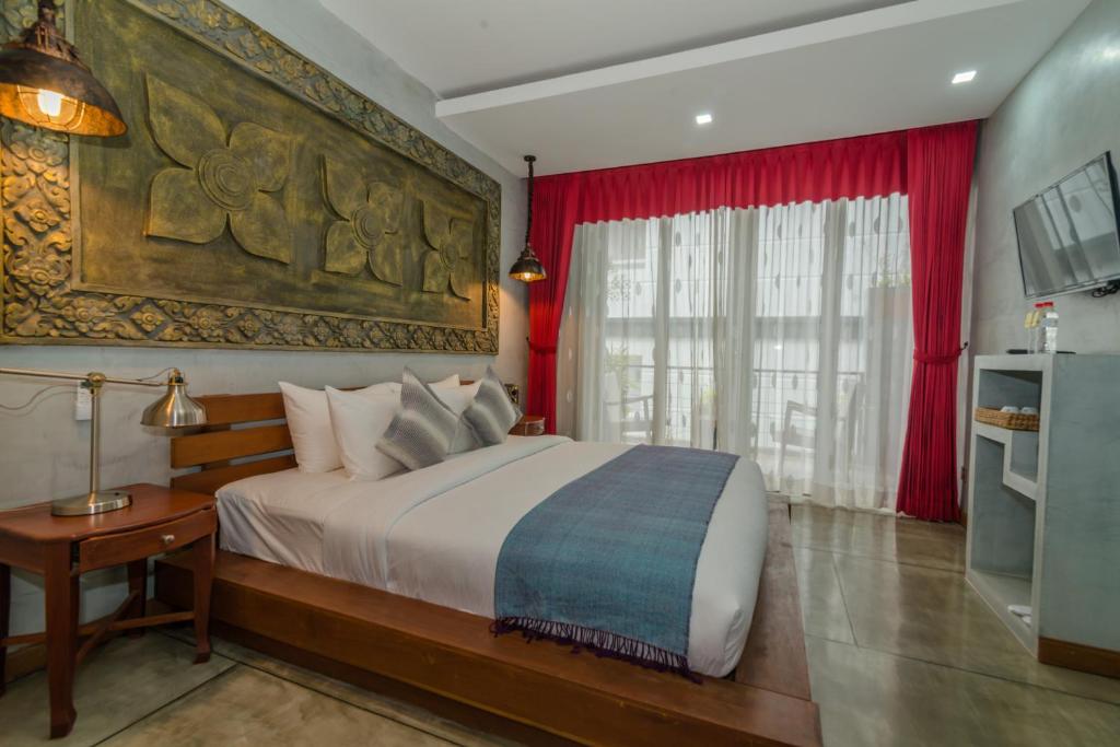 Postel nebo postele na pokoji v ubytování Cambana Residence