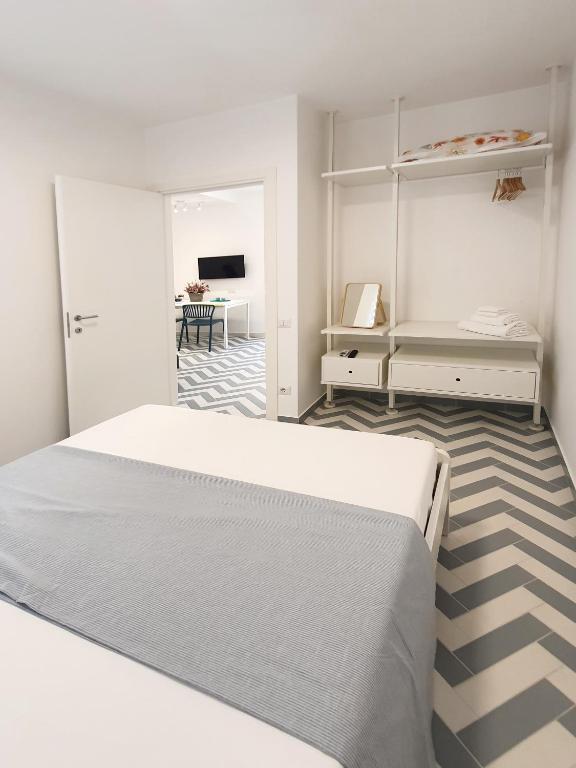 Łóżko lub łóżka w pokoju w obiekcie La Casa di Mina