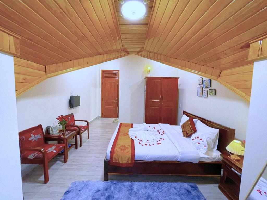 Postel nebo postele na pokoji v ubytování Moc Nhien Hostel Da Lat
