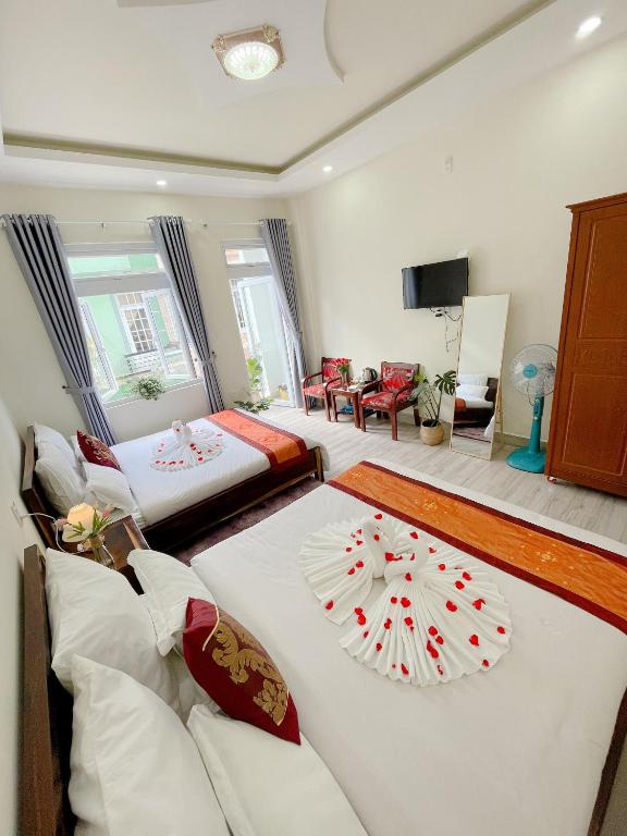 Postel nebo postele na pokoji v ubytování Moc Nhien Hostel Da Lat
