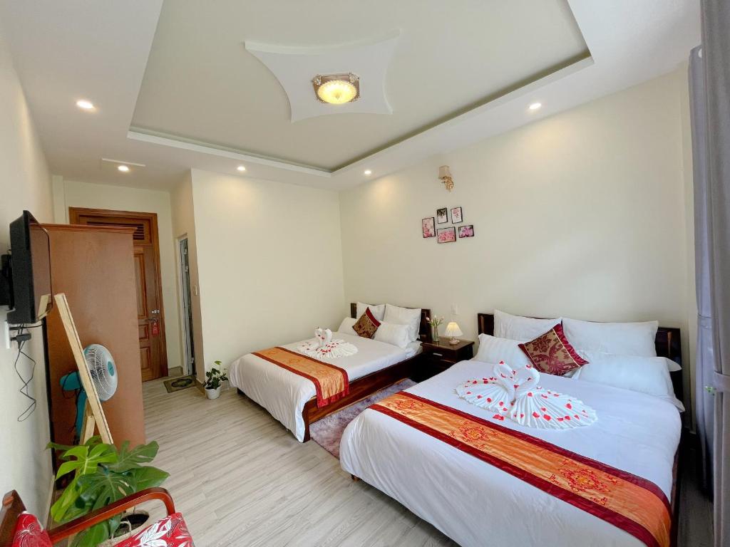 Postel nebo postele na pokoji v ubytování Moc Nhien Hostel Da Lat