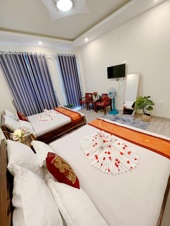 Postel nebo postele na pokoji v ubytování Moc Nhien Hostel Da Lat