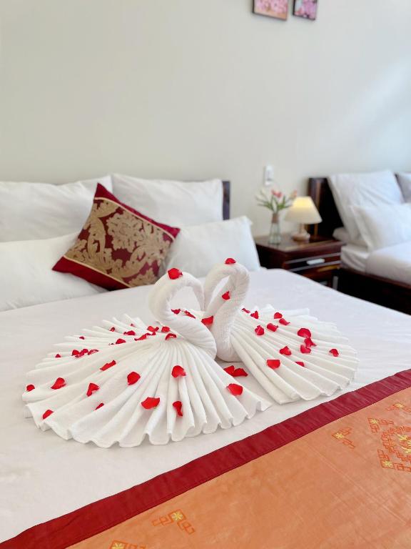 Postel nebo postele na pokoji v ubytování Moc Nhien Hostel Da Lat