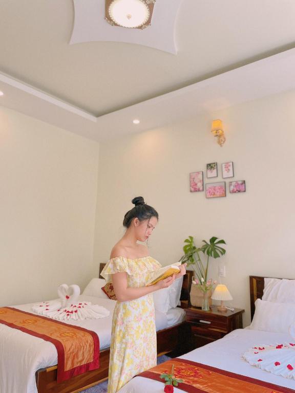 Postel nebo postele na pokoji v ubytování Moc Nhien Hostel Da Lat