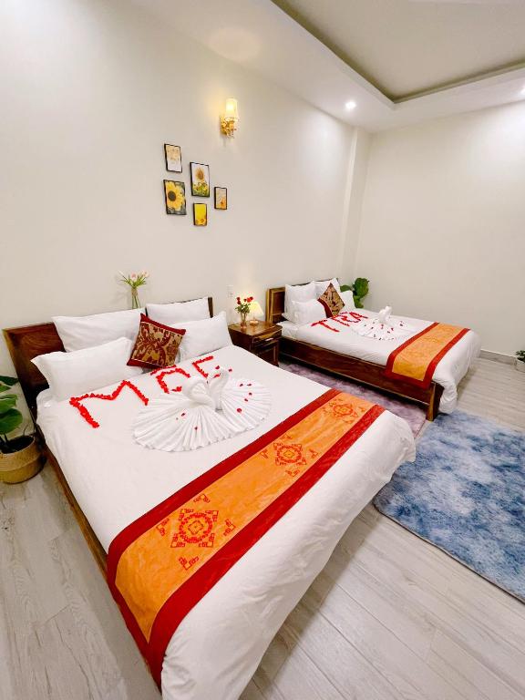 Postel nebo postele na pokoji v ubytování Moc Nhien Hostel Da Lat