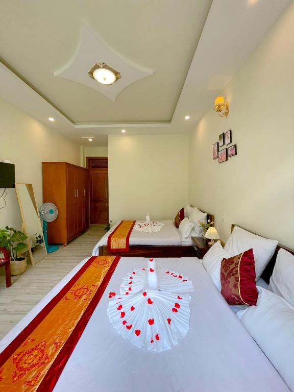 Postel nebo postele na pokoji v ubytování Moc Nhien Hostel Da Lat