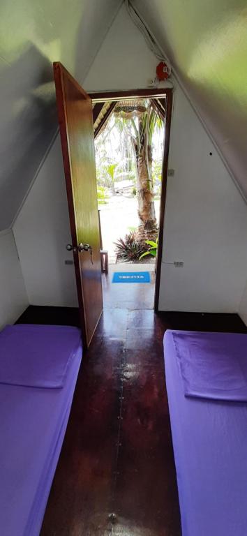 Letto o letti in una camera di Dream Catcher Nipas Siargao