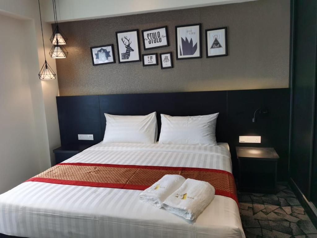 Postel nebo postele na pokoji v ubytování Hotel Damai Kuala Lumpur