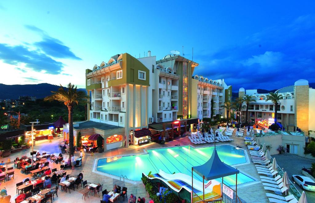 a view of a hotel with a swimming pool at Grand Cettia Hotel in Marmaris