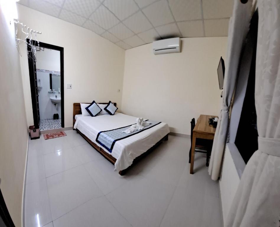 Postel nebo postele na pokoji v ubytování Blue Beach Homestay
