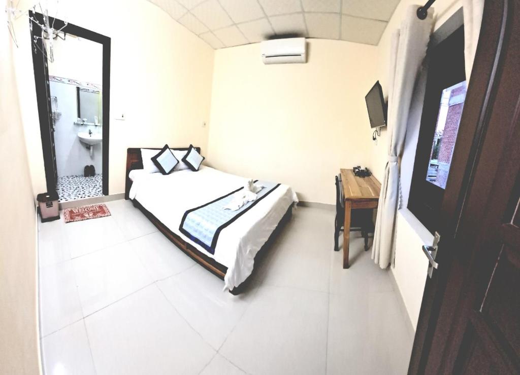 Postel nebo postele na pokoji v ubytování Blue Beach Homestay