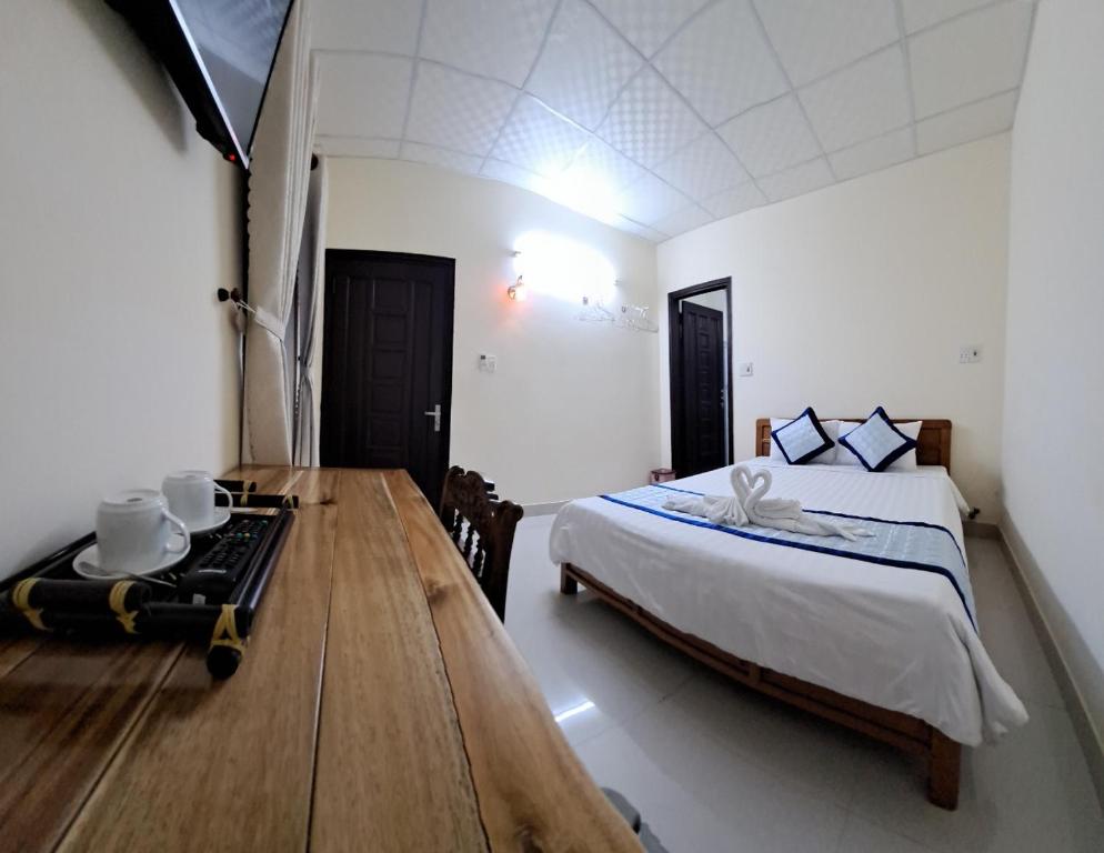 Postel nebo postele na pokoji v ubytování Blue Beach Homestay